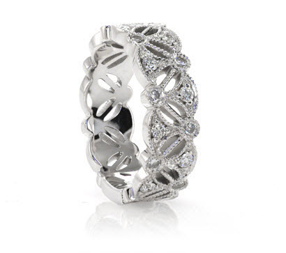 Diamond Wedding Band featuring bezel set round diamonds with milgrain.